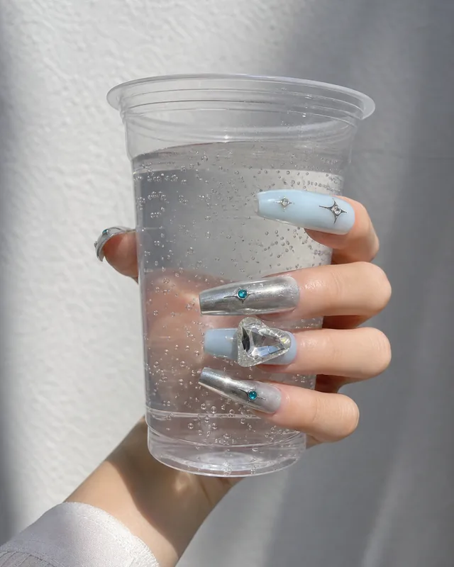 Blue Starfield Press-On Nails worn on hand
