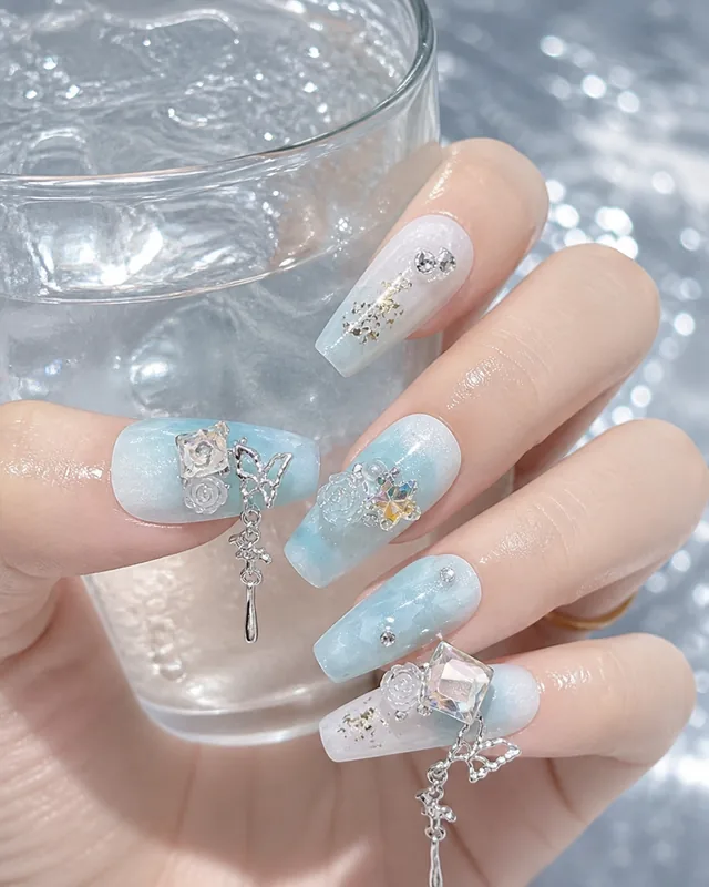 Butterfly Mist Camellia Press-On Nails worn on hand