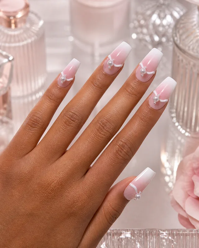 Embossed Blush Press-On Nails worn on hand
